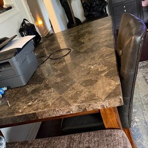 Sophisticated Marble Dining Table with Brown Accents